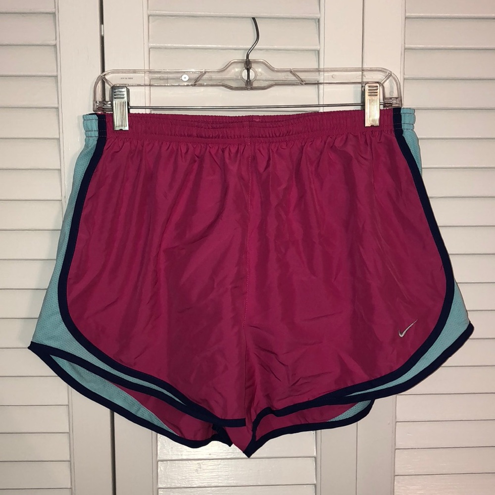Women’s pink nike running shorts.